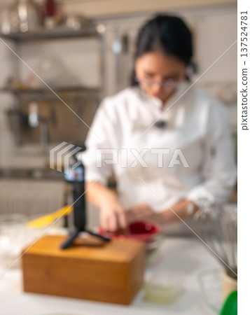 Food Content Creator Filming Cooking Video with Ring Light and Studio Equipment in Kitchen 137524781