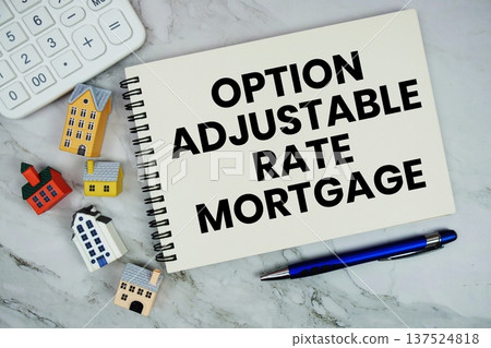 Option Adjustable Rate Mortgage text written on notepad with house model on marble background Option Adjustable Rate Mortgage text written on notepad with house model on marble background 137524818