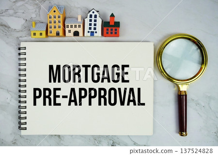 Mortgage Pre-Approval text written on notepad with house model and magnifying glass on marble background Mortgage Pre-Approval text written on notepad with house model and magnifying glass on marble background 137524828
