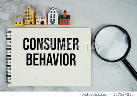 Consumer Behavior text written on notepad with house model and magnifying glass on marble background Consumer Behavior text written on notepad with house model and magnifying glass on marble background 137524833