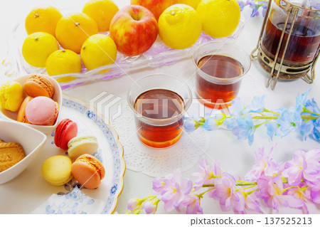 Macaroons, fruits and tea Macaroons, fruits and tea 137525213