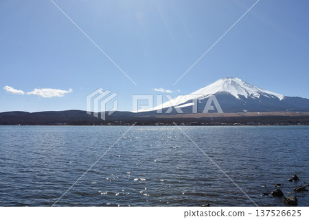 A clear sky and a spectacular view of Mt. Fuji from Lake Yamanaka A clear sky and a spectacular view of Mt. Fuji from Lake Yamanaka 137526625