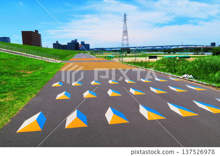 A view of the vivid road markings on the Arakawa Cycling Road A view of the vivid road markings on the Arakawa Cycling Road 137526978