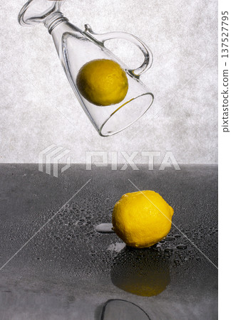 Still life with two lemons and a glass goblet Still life with two lemons and a glass goblet 137527795