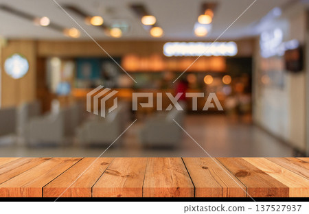 brown wooden board over blurred bokeh indoor brown wooden board over blurred bokeh indoor 137527937