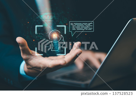 Businessman using AI chatbot on laptop for communication. Concept of generative AI, digital assistant, and smart technology interface in business. 137528523