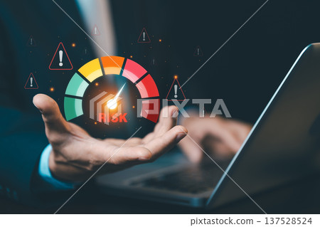 Businessman showing risk assessment meter with warning icons. Concept of risk management, financial security, crisis control, and business evaluation. 137528524