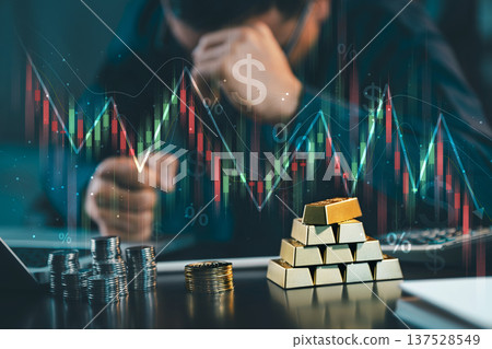 Stressed investor with gold bars and coins looking at falling stock market chart. Concept of financial crisis, inflation, economic recession, and investment loss. 137528549