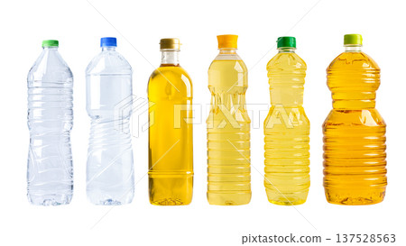 Vegetable oil and water in different bottle for cooking isolated on white background. Vegetable oil and water in different bottle for cooking isolated on white background. 137528563