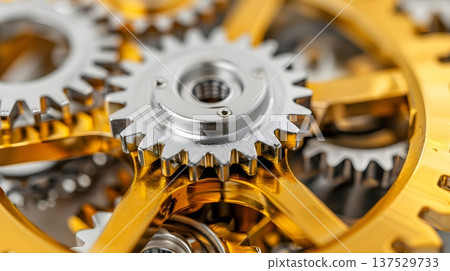 Interlocking gold and silver gears represent teamwork and systems 137529733