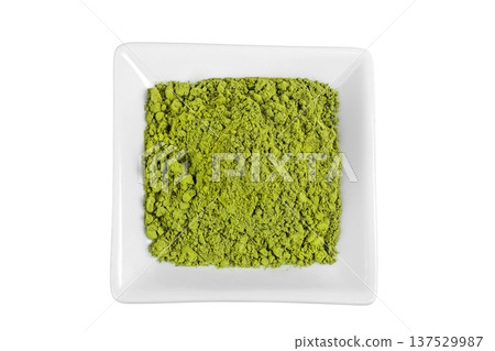 Green matcha powder in ceramic bowl isolated on white background. Top view Green matcha powder in ceramic bowl isolated on white background. Top view 137529987