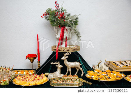 Christmas holiday catering buffet with festive appetizers and decorations Christmas holiday catering buffet with festive appetizers and decorations 137530611