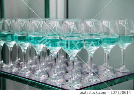 Wine glasses filled with teal liquid for celebration Wine glasses filled with teal liquid for celebration 137530614