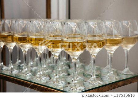 White wine glasses serving at luxury catering event White wine glasses serving at luxury catering event 137530616
