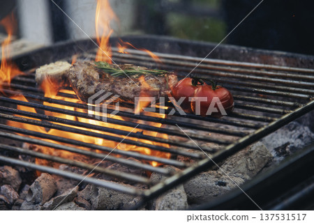 BBQ Barbecue grilled meat stick on fire flame with hot charcoal cooking outside. Beef grilling picnic outdoor with smoke bacon spicy sausage for party. Grill pork bbq on fire flame 137531517
