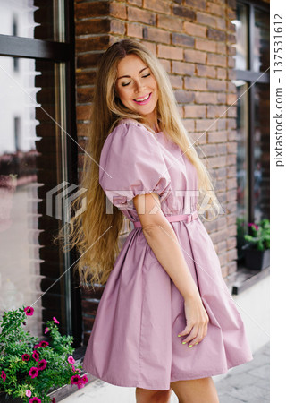 Fashionable Woman Smiling In Pink Dress 137531612