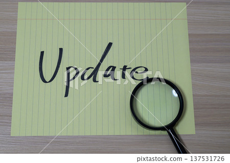 Update and investigation concept with the word "Update" and a magnifying glass Update and investigation concept with the word "Update" and a magnifying glass 137531726