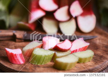Close perspective of chopped rhubarb with kitchen knife Close perspective of chopped rhubarb with kitchen knife 137532101