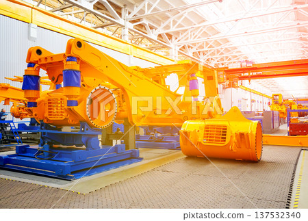 Mining machinery in factory during daytime showing equipment, workspace in action. In factory  137532340
