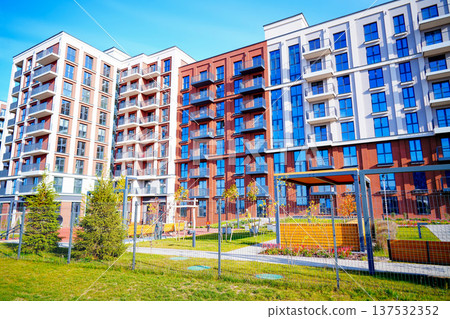 Playground in a residential complex. Closed playground in modern courtyard at residential building Playground in a residential complex. Closed playground in modern courtyard at residential building 137532352