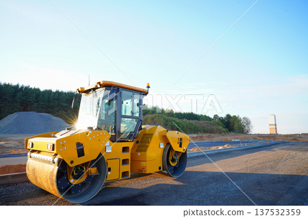 Road Asphalting construction. Asphalt paving repair. Vibrator compactor machine on roadworks. Road Asphalting construction. Asphalt paving repair. Vibrator compactor machine on roadworks. 137532359