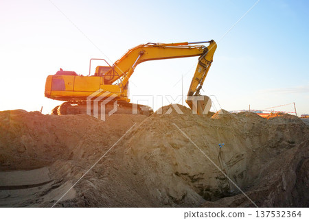 Excavator earthworks on construction site. Sewer line repair. Excavator groundwork water line repair Excavator earthworks on construction site. Sewer line repair. Excavator groundwork water line repair 137532364