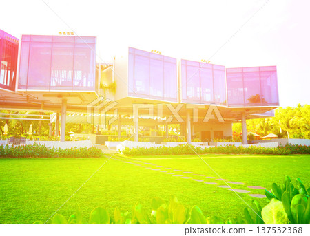 Resort at tall hotel building and palm trees in tropical. Swimming pool at hotel resort  137532368