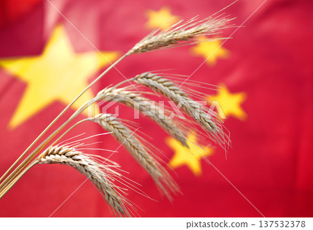 Wheat on China flag background. Wheat grain. UE China wheat export prices. Export curbs.  137532378