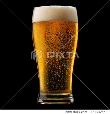 Foamy amber ale beer in a tall glass with creamy foam head, isolated on black background, concept of refreshment and taste 137532448