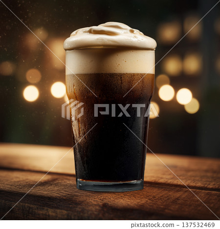 A frothy dark stout beer on wooden bar table in warm bokeh ambient pub setting background, concept of cozy relaxation pub mood A frothy dark stout beer on wooden bar table in warm bokeh ambient pub setting background, concept of cozy relaxation pub mood 137532469