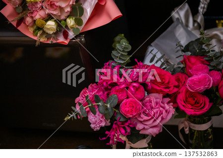 Vibrant Pink Roses and Peonies Bouquet on Dark Background Vibrant Pink Roses and Peonies Bouquet on Dark Background 137532863