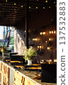 Rooftop Bar Counter with Floral Decor and Warm Lights 137532883