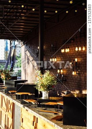 Rooftop Bar Counter with Floral Decor and Warm Lights 137532883
