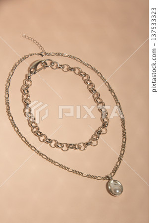 Artistic Presentation Of Layered Chains And Pearls Highlighting Tactile And Visual Elegance In Natural Light Artistic Presentation Of Layered Chains And Pearls Highlighting Tactile And Visual Elegance In Natural Light 137533323