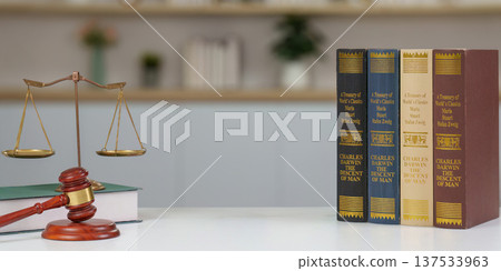 Legal Background with Scales and Law Books. A lawyer's desk featuring legal texts and a gavel. Legal Background with Scales and Law Books. A lawyer's desk featuring legal texts and a gavel. 137533963