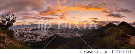 Panoramic sunset view of Nha Trang city coastline from mountain viewpoint Vietnam Panoramic sunset view of Nha Trang city coastline from mountain viewpoint Vietnam 137534131