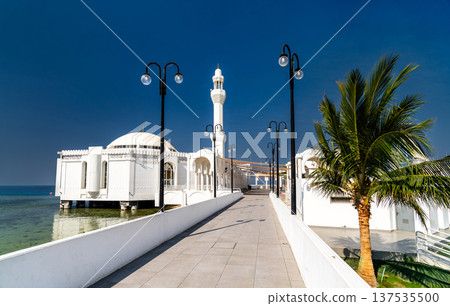 Exterior view of the Al Rahma Floating Mosque on the Red Sea coast in Jeddah, Saudi Arabia, during a bright sunny day Exterior view of the Al Rahma Floating Mosque on the Red Sea coast in Jeddah, Saudi Arabia, during a bright sunny day 137535500
