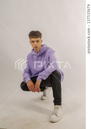 Handsome young guy in stylish clothes on white Handsome young guy in stylish clothes on white 137535674