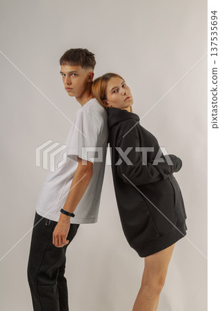 Beautiful young guy and girl in stylish clothes on 137535694