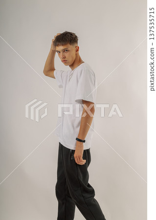 Handsome young guy in stylish clothes on white Handsome young guy in stylish clothes on white 137535715