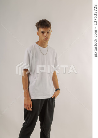 Handsome young guy in stylish clothes on white 137535728