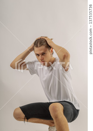 Handsome young guy in stylish clothes on white 137535736