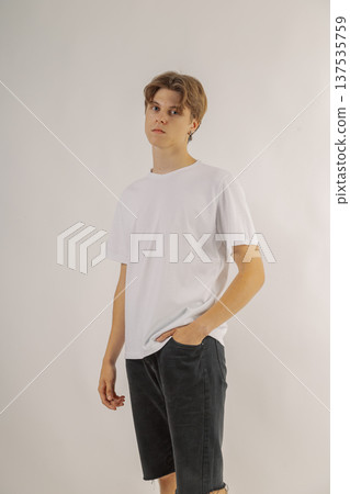 Handsome young guy in stylish clothes on white Handsome young guy in stylish clothes on white 137535759