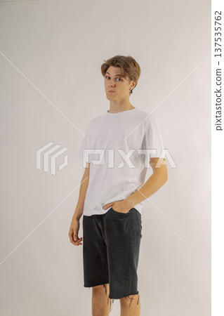 Handsome young guy in stylish clothes on white Handsome young guy in stylish clothes on white 137535762