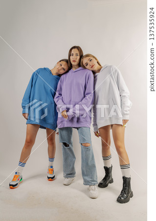 Group of young people in stylish clothes on white Group of young people in stylish clothes on white 137535924