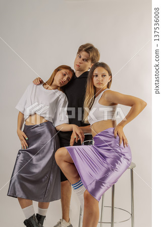Group of young people in stylish clothes on white Group of young people in stylish clothes on white 137536008