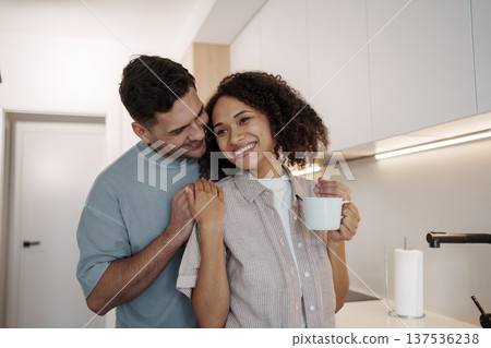 Loving Pair Laughing Together In Welcoming Kitchen Environment Filled With Happiness And Closeness Loving Pair Laughing Together In Welcoming Kitchen Environment Filled With Happiness And Closeness 137536238