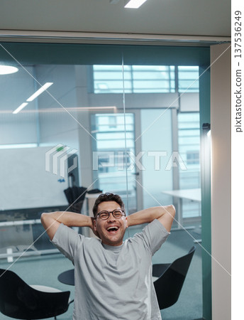 Individual Feels Pleased And Thoughtful. Supervisor Unwinds Following Achievements And Contemplation Individual Feels Pleased And Thoughtful. Supervisor Unwinds Following Achievements And Contemplation 137536249