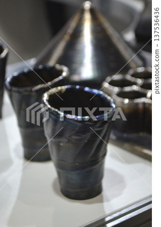 Model printed on 3D printer from metal. Object created on 3D printer from melting metal thread. Modern new technologies. Additive progressive manufacturing solution. Metal 3d printing technology Model printed on 3D printer from metal. Object created on 3D printer from melting metal thread. Modern new technologies. Additive progressive manufacturing solution. Metal 3d printing technology 137536436
