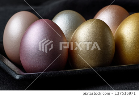 Close Up Metallic Eggs In Black Fabric Close Up Metallic Eggs In Black Fabric 137536971